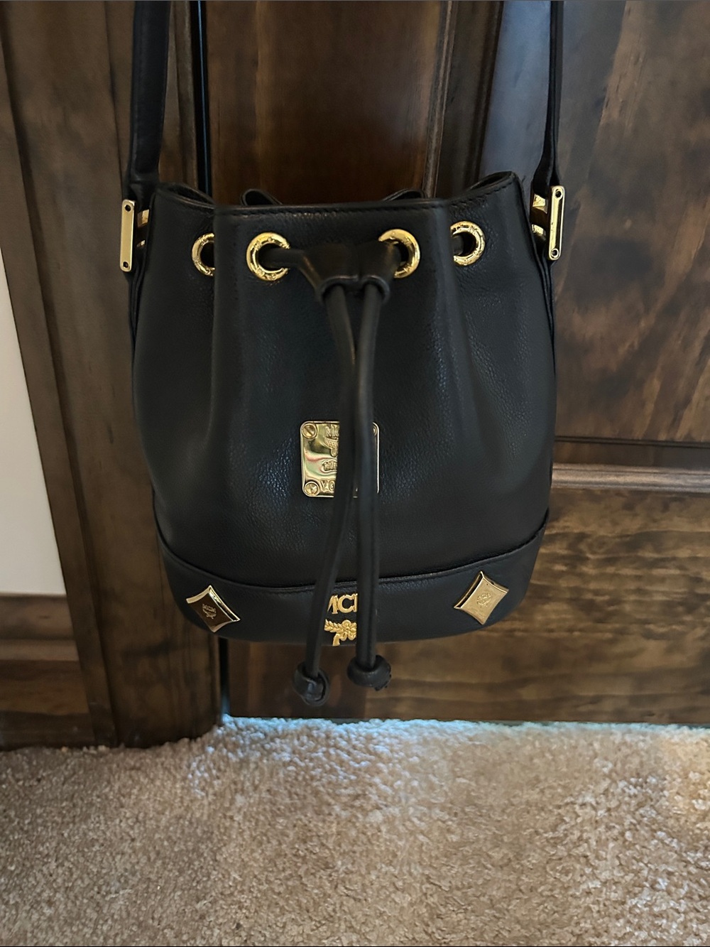 MCM Black Leather Mini Drawstring Bucket Bag with Gold Accents - Picture 2 of 14